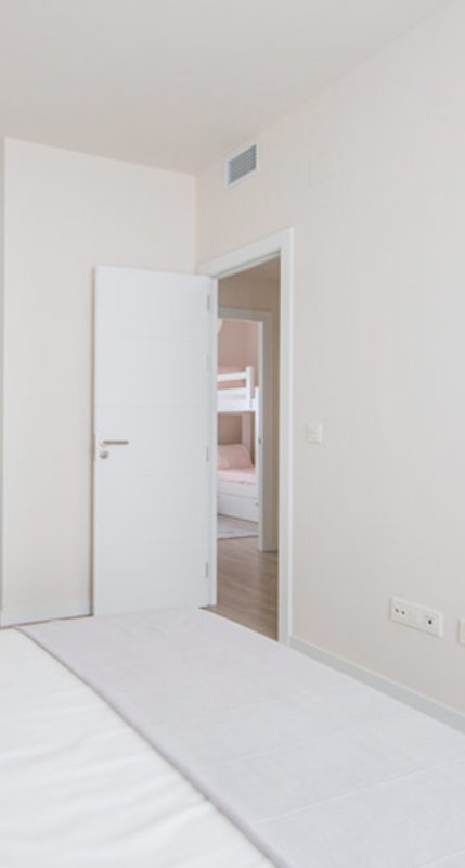 Dormitorio suite de la promoción de obra nueva Jardines Hacienda del Rosario en Sevilla